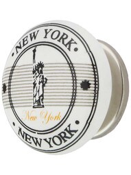 White Porcelain Statue of Liberty Souvenir Cabinet Knob with Brass Base in Polished Nickel.